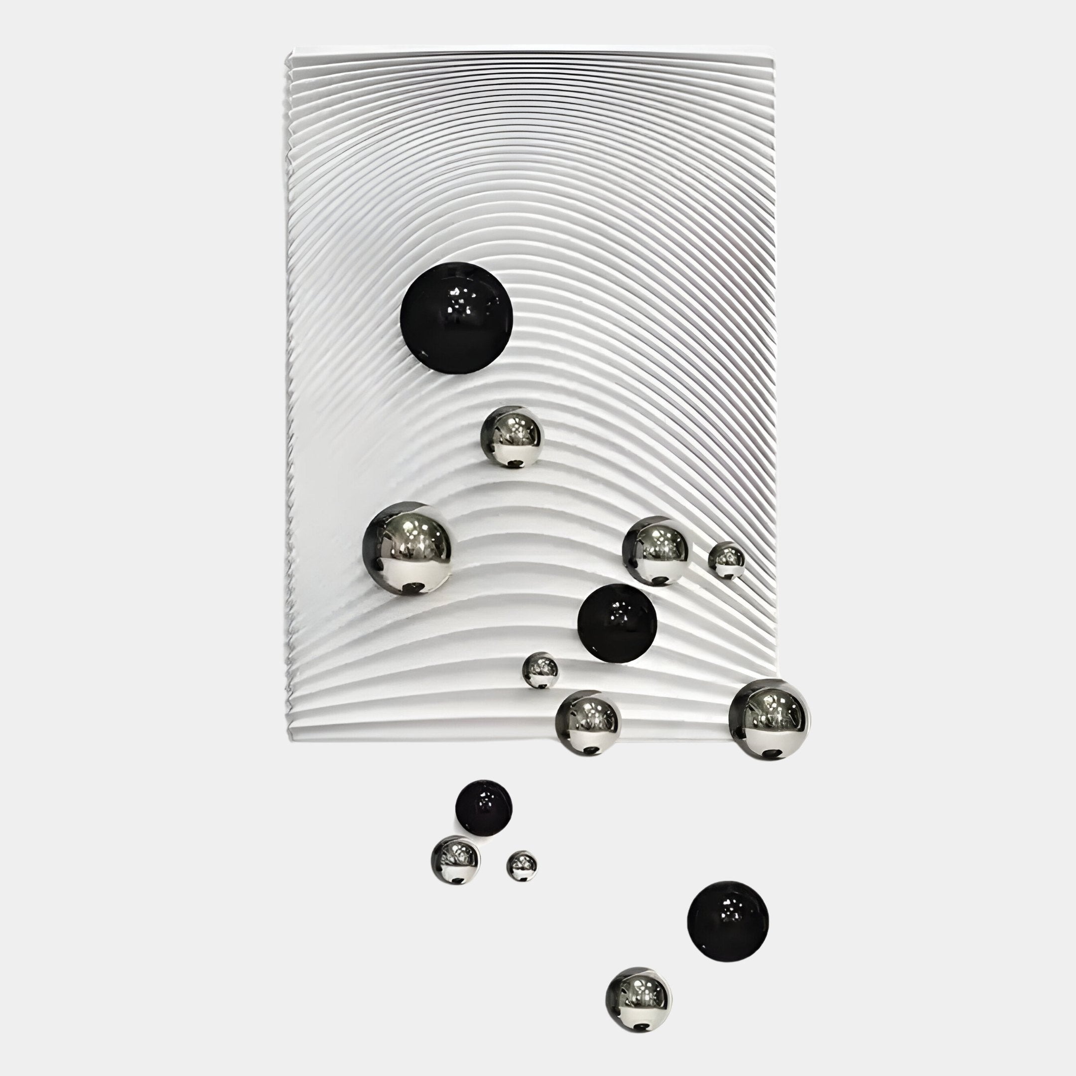 The Sphera White 3D Wood Relief Wall Art by Giant Sculptures features raised concentric ripples and sleek black and silver metal balls, creating a striking modern statement with its abstract design.