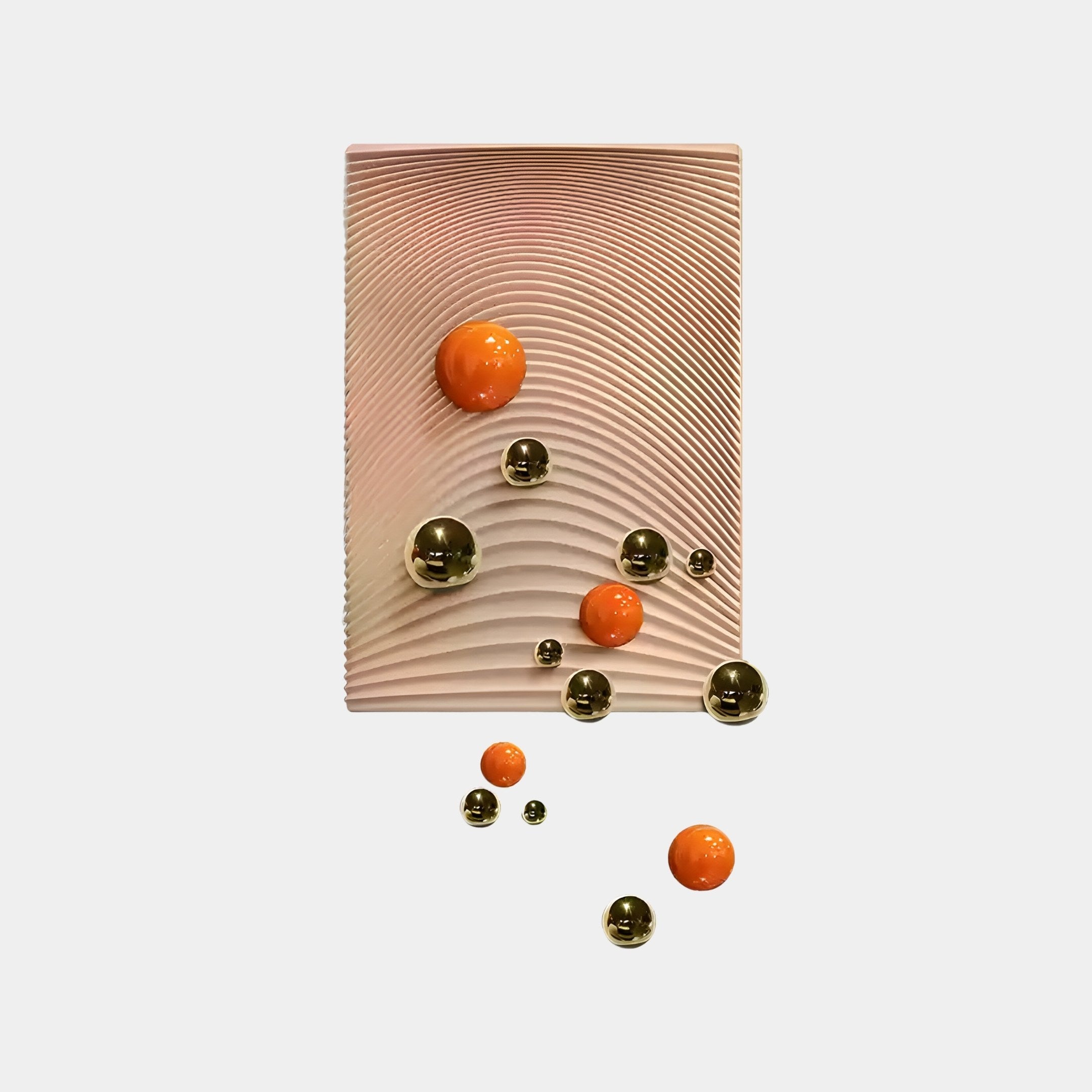The Sphera Amber 3D Wood Relief Wall Art by Giant Sculptures showcases a textured rectangular panel with wavy lines, embellished with glossy orange and metallic gold spheres. These varied-sized Gold & Orange Metal Balls are attached or float below the panel on a light-colored background.