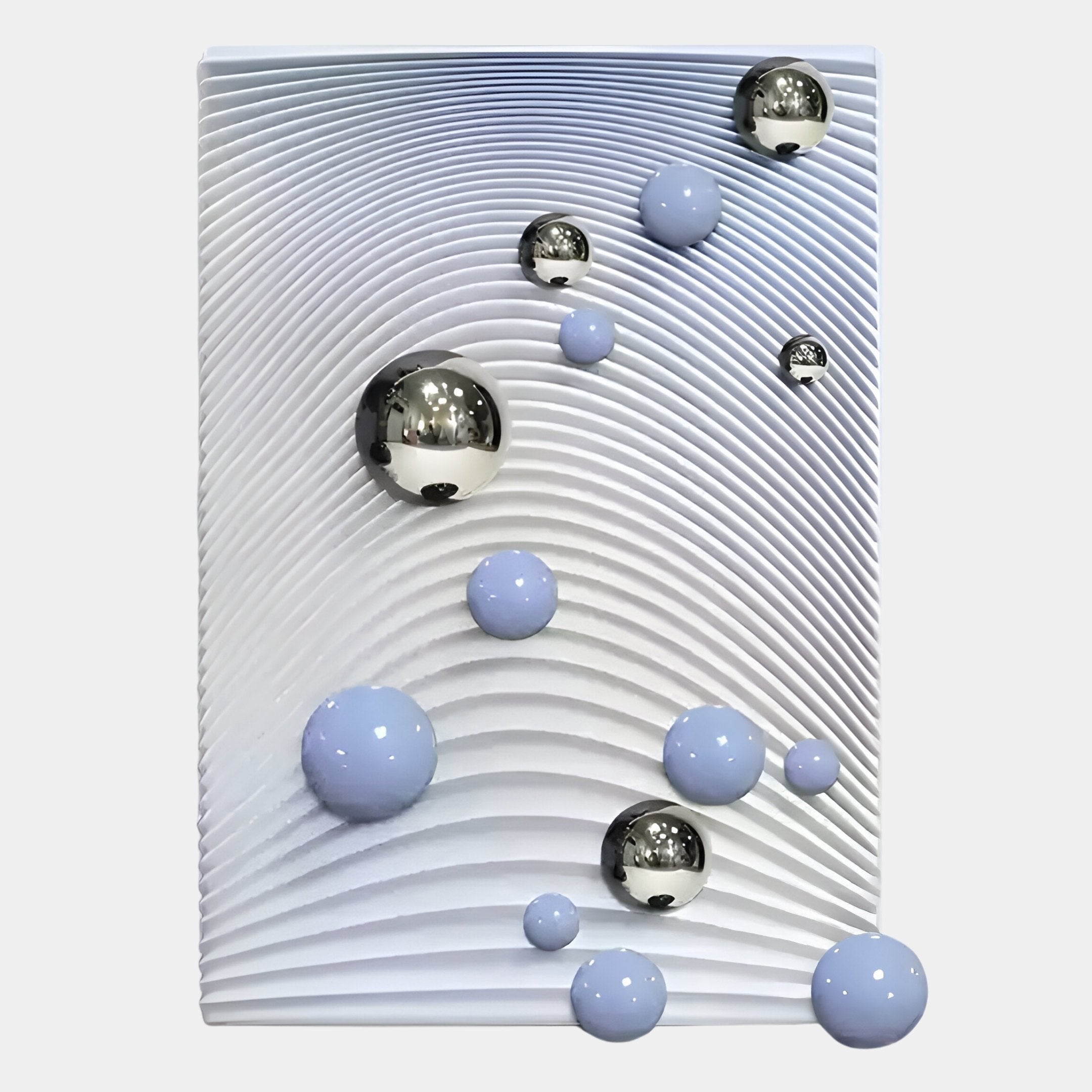 The Sphera Gradient 3D Wood Relief Wall Art by Giant Sculptures features raised concentric curved lines with blue and silver gradient metal balls on a textured white background.