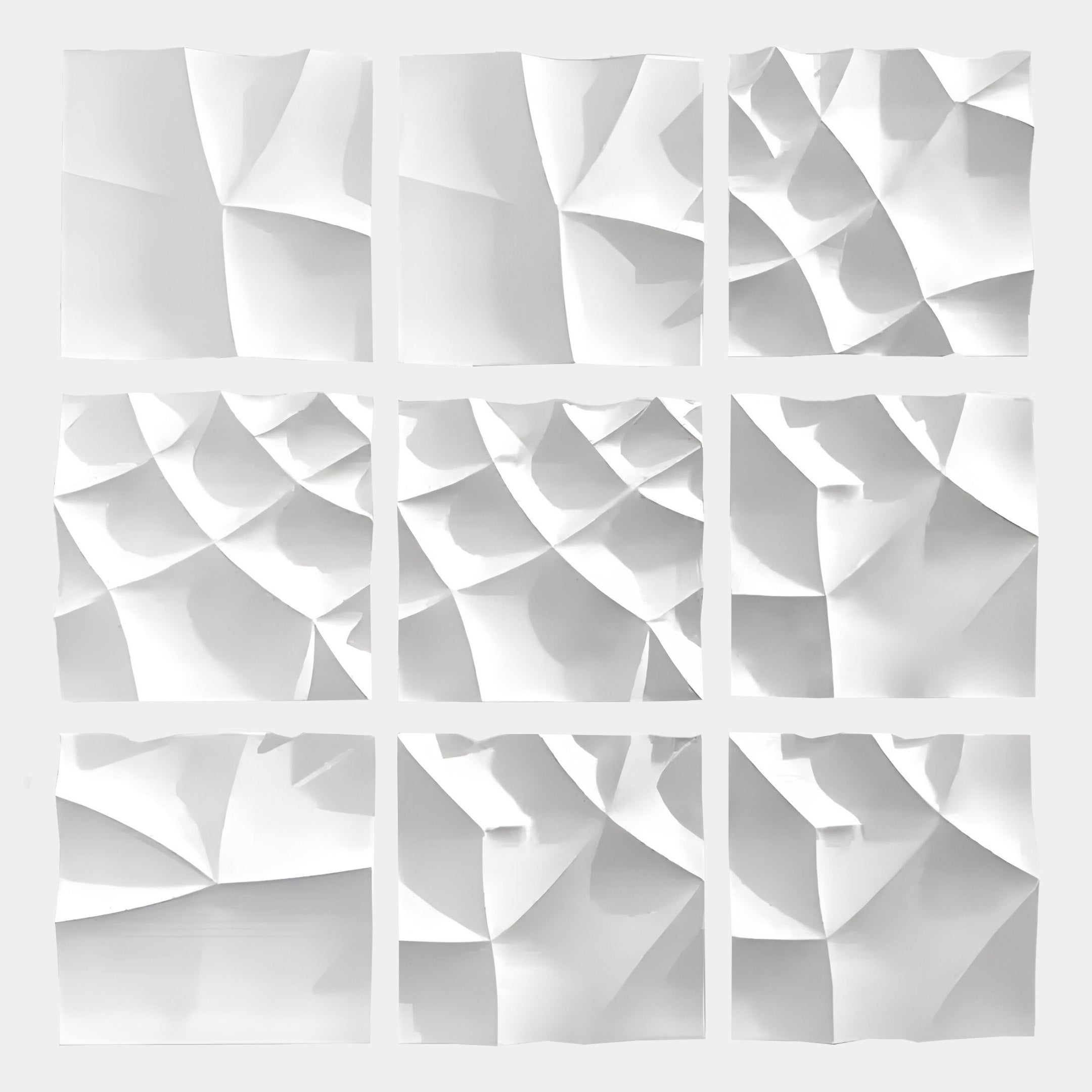 Nine sculpted square panels form the Giant Sculptures Tessara 9-Panel Set White 3D Wood Relief Wall Art, creating a striking 3x3 grid with elegant abstract textures that cast unique patterns of light and shadow.