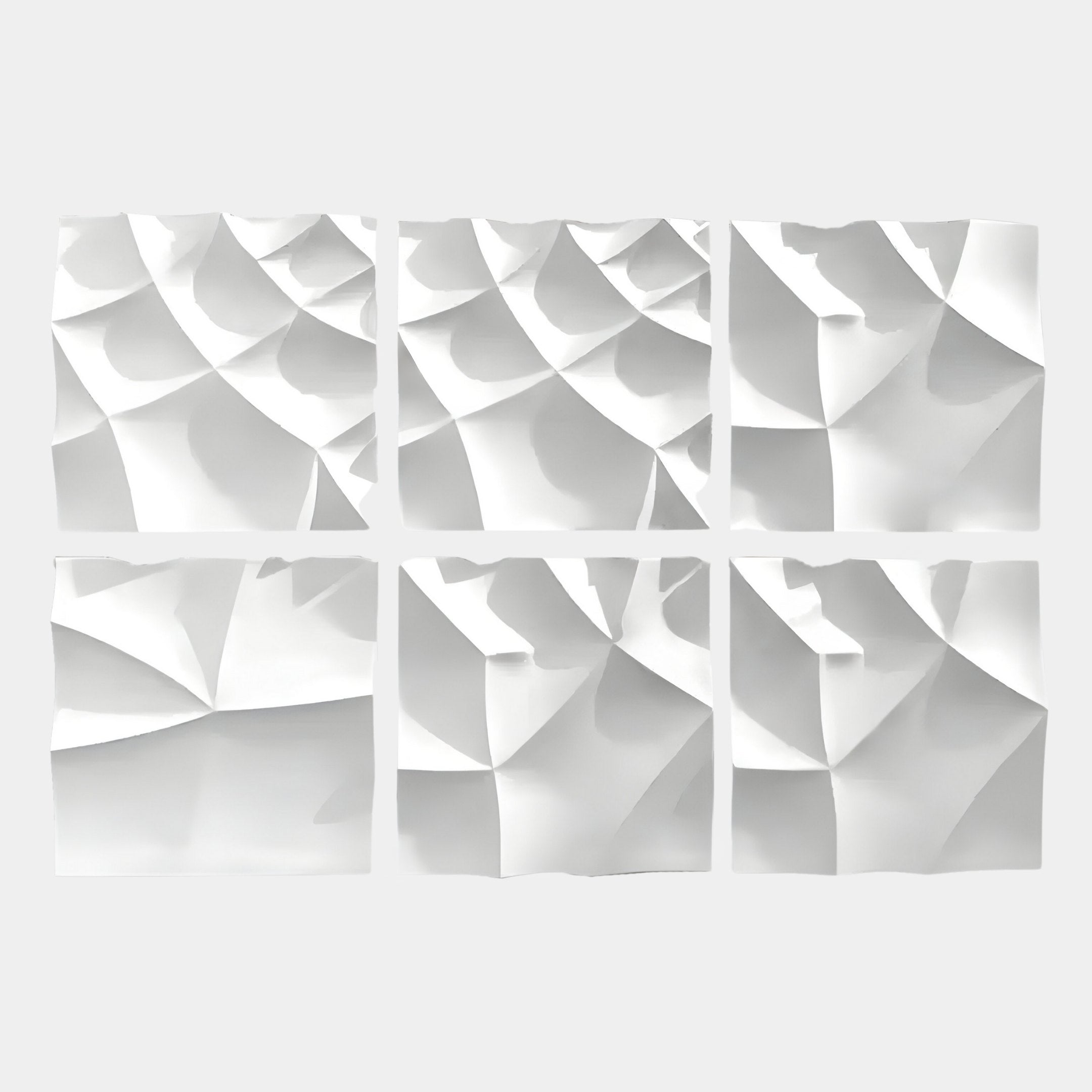 The Tessara 6-Panel Set White 3D Wood Relief Wall Art by Giant Sculptures features six white panels with abstract, wave-like geometric patterns, adding depth and movement through smooth folds and sharp angles. Arranged in two rows of three.