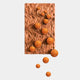 The Fluxion Orange 3D Wood Relief Wall Art With Metal Ball by Giant Sculptures showcases a wavy rectangular surface with glossy metal spheres in diagonal arrangement—an eye-catching modern decor piece on a plain white background.