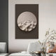 A minimalist room features Giant Sculptures Solivis Desert 3D Wood Relief Wall Art. Below, a sleek white chair and table with a decorative plant enhance the sophisticated, neutral-toned décor.