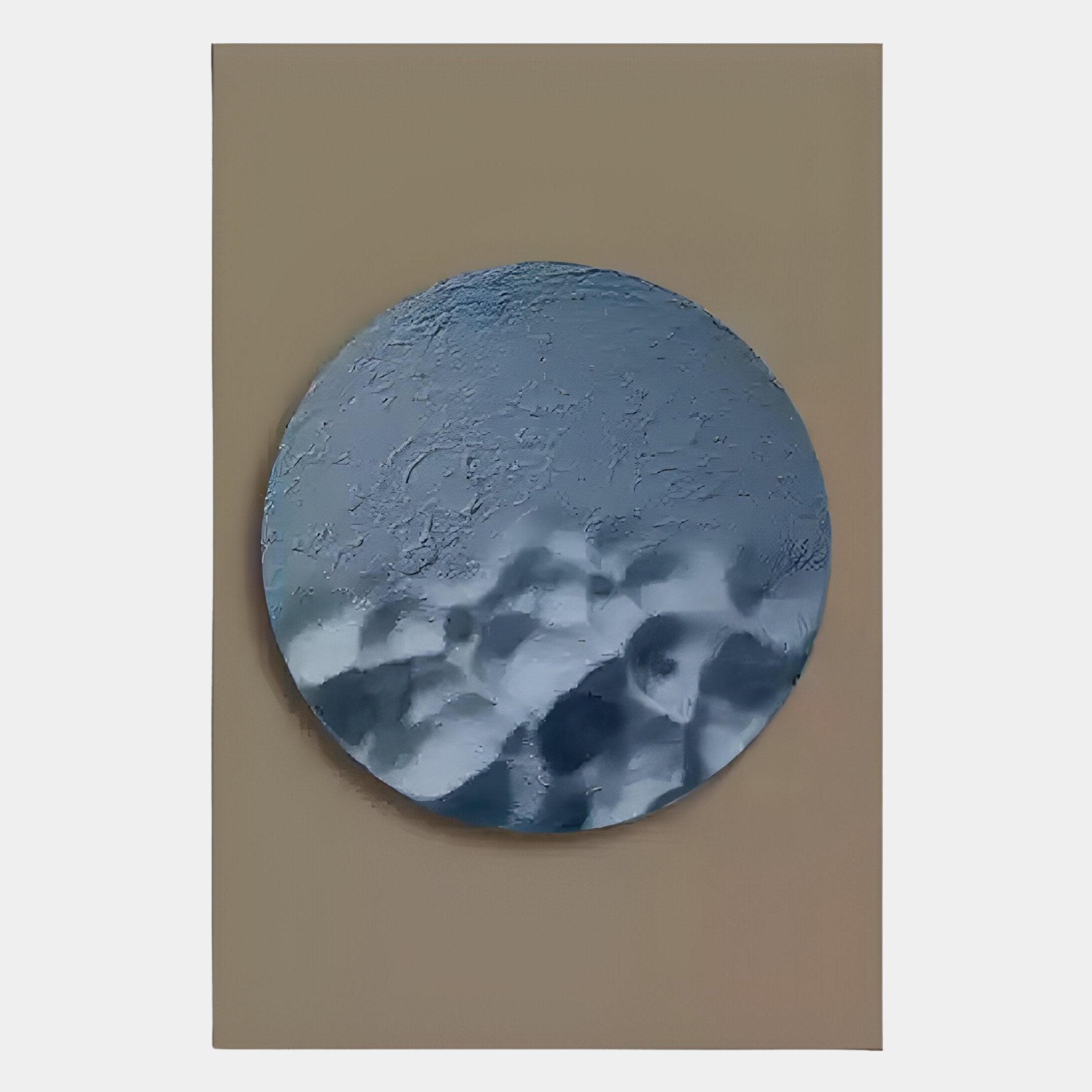 The Solivis Ocean 3D Wood Relief Wall Art by Giant Sculptures features a round, textured metallic-gray design with a reflective, wavy surface on a beige background—ideal as contemporary maritime-inspired wall decor.