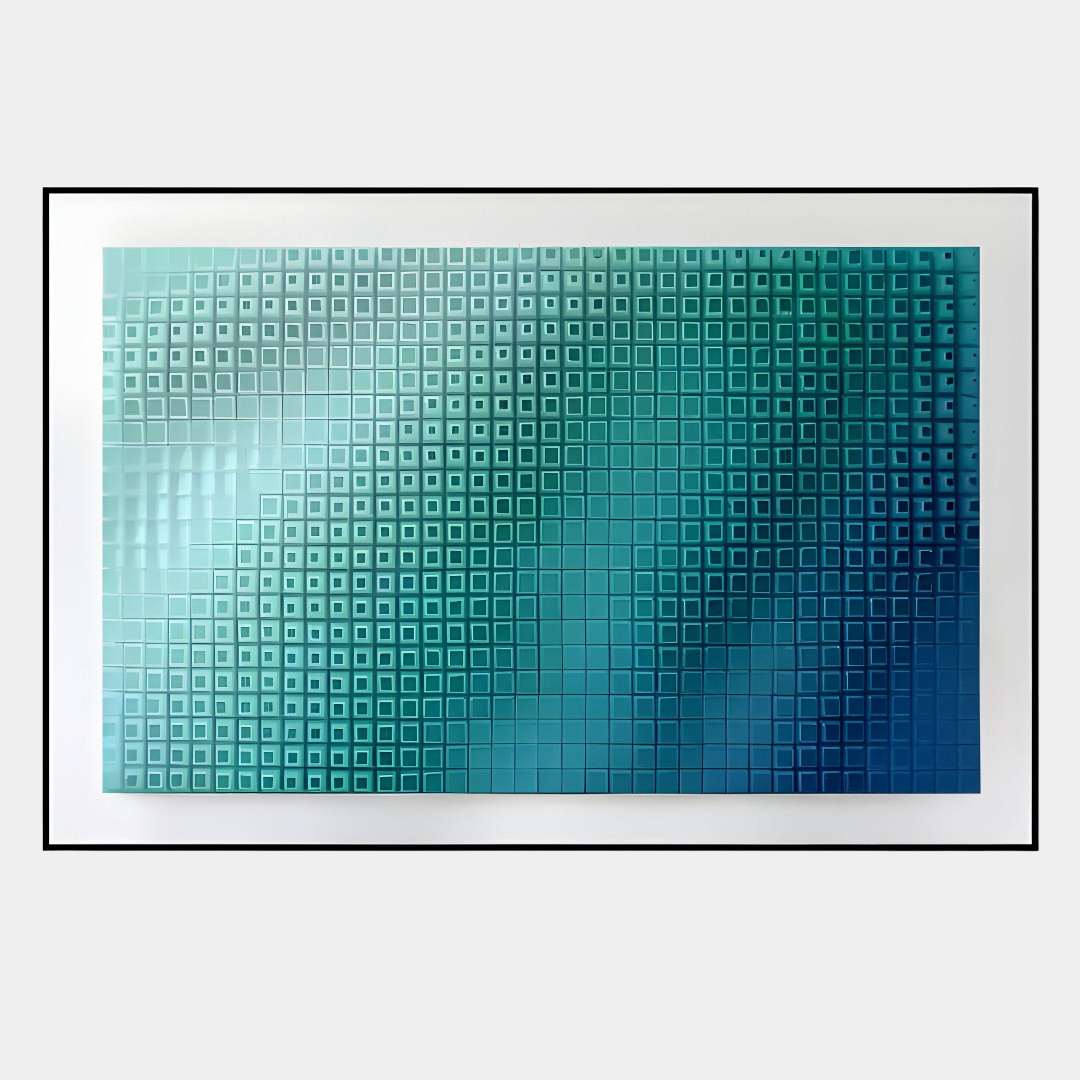 The Elytrum Blue Grid Gradient Hand-Painted Wood Relief 3D Wall Art by Giant Sculptures features raised square tiles in blue and teal shades, forming a striking blue gradient framed by a sleek black border.