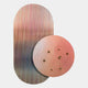 The Embera Abstract Circle Warm Blush Gradient 3D Wall Art by Giant Sculptures features a metallic striped oval and a blush gradient circle with raised patterns and gold spheres, creating striking, dimensional art.