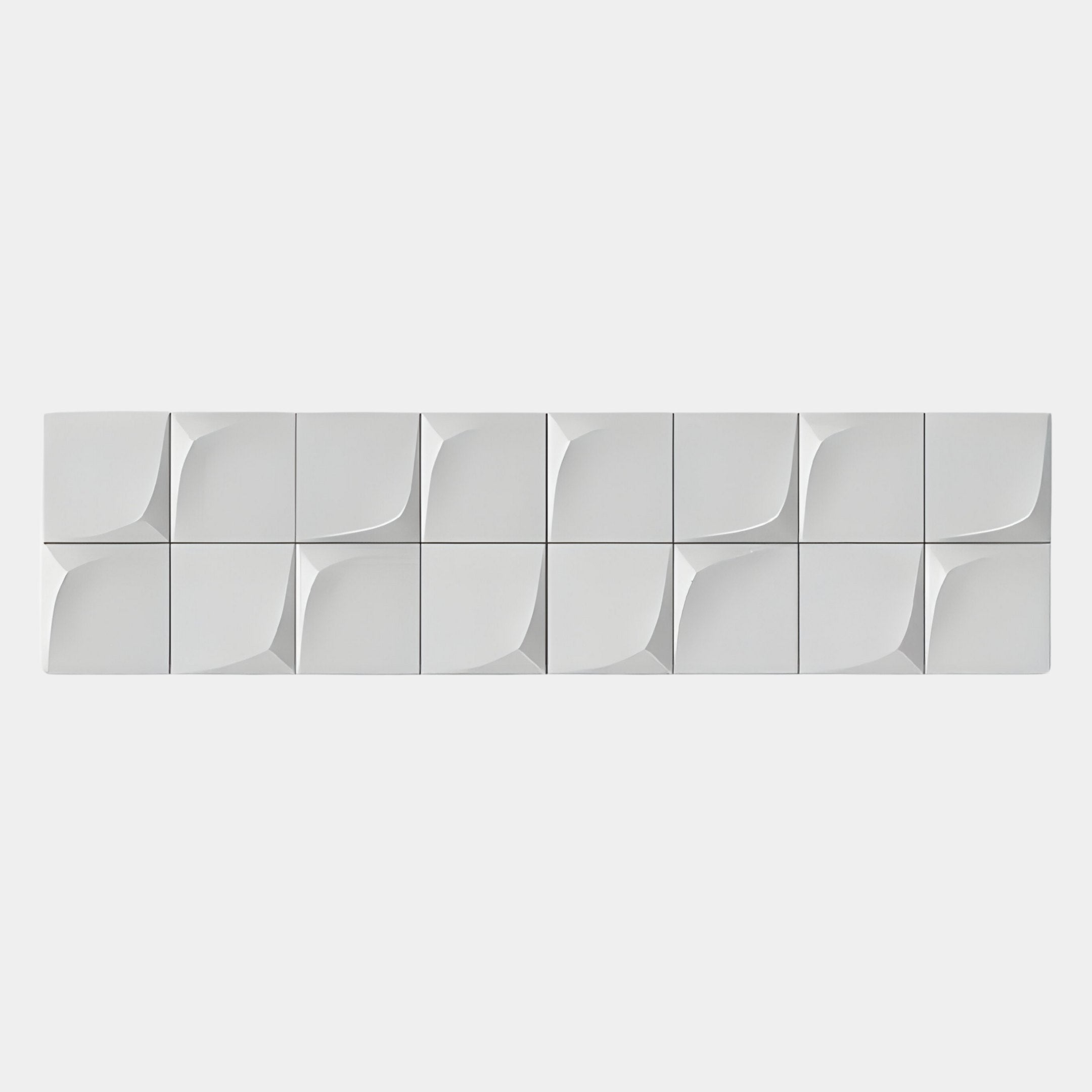A row of twelve Averra White Linear Wood Relief 3D Wall Art tiles by Giant Sculptures features curved, geometric patterns, adding striking 3D style to modern interiors against a plain, light background for a clean effect.