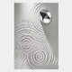 A metallic accent is set in a white surface with rippled patterns, evoking Giant Sculptures Ondella Silver Ripple IV Sandstone Wood Relief 3D Wall Art and reflecting subtle Wabi-sabi aesthetics.