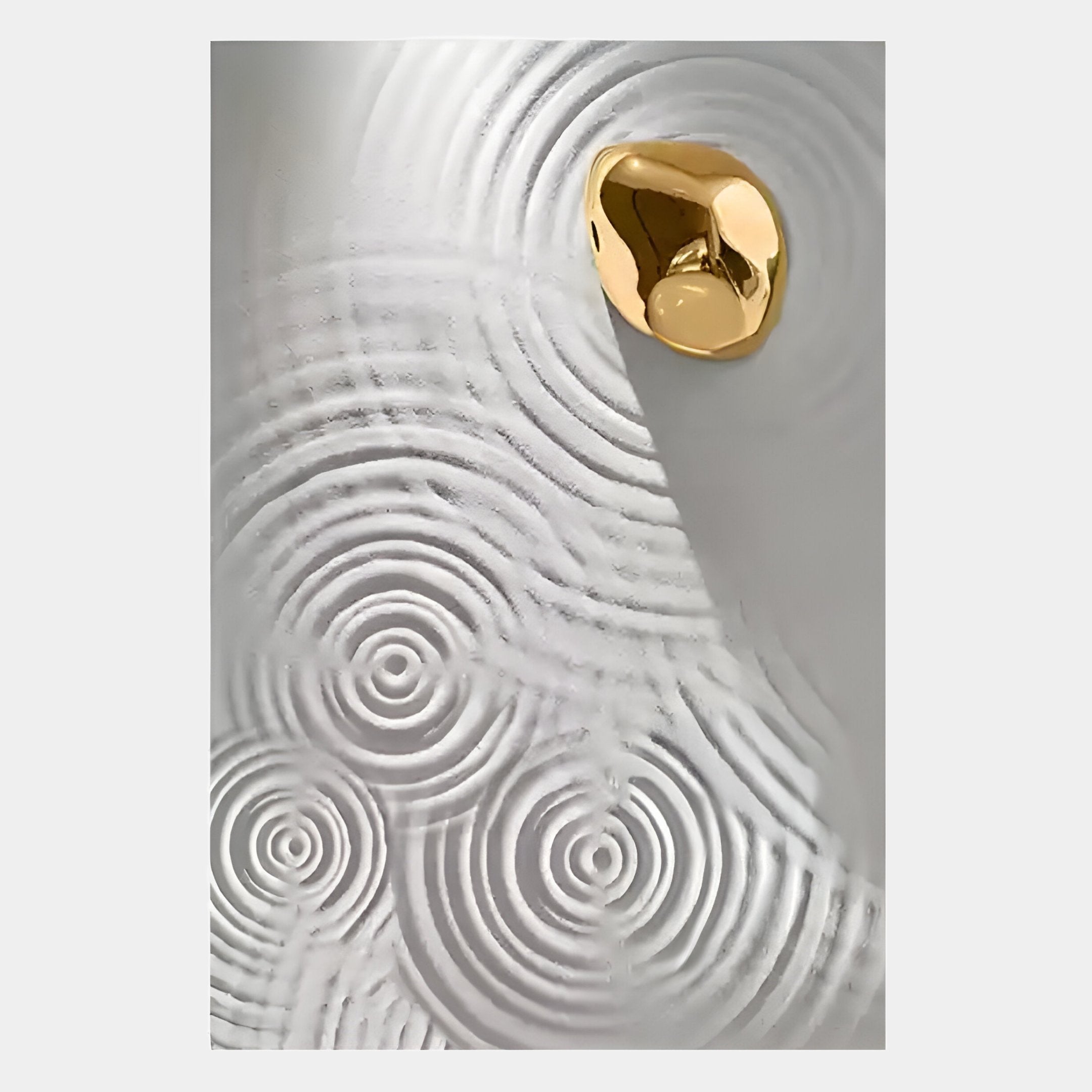 The Ondella Gold Ripple IV Sandstone Wood Relief 3D Wall Art by Giant Sculptures features a shiny gold accent on textured white, with raised concentric circular patterns evoking water ripples and dramatic shadows on the right side.