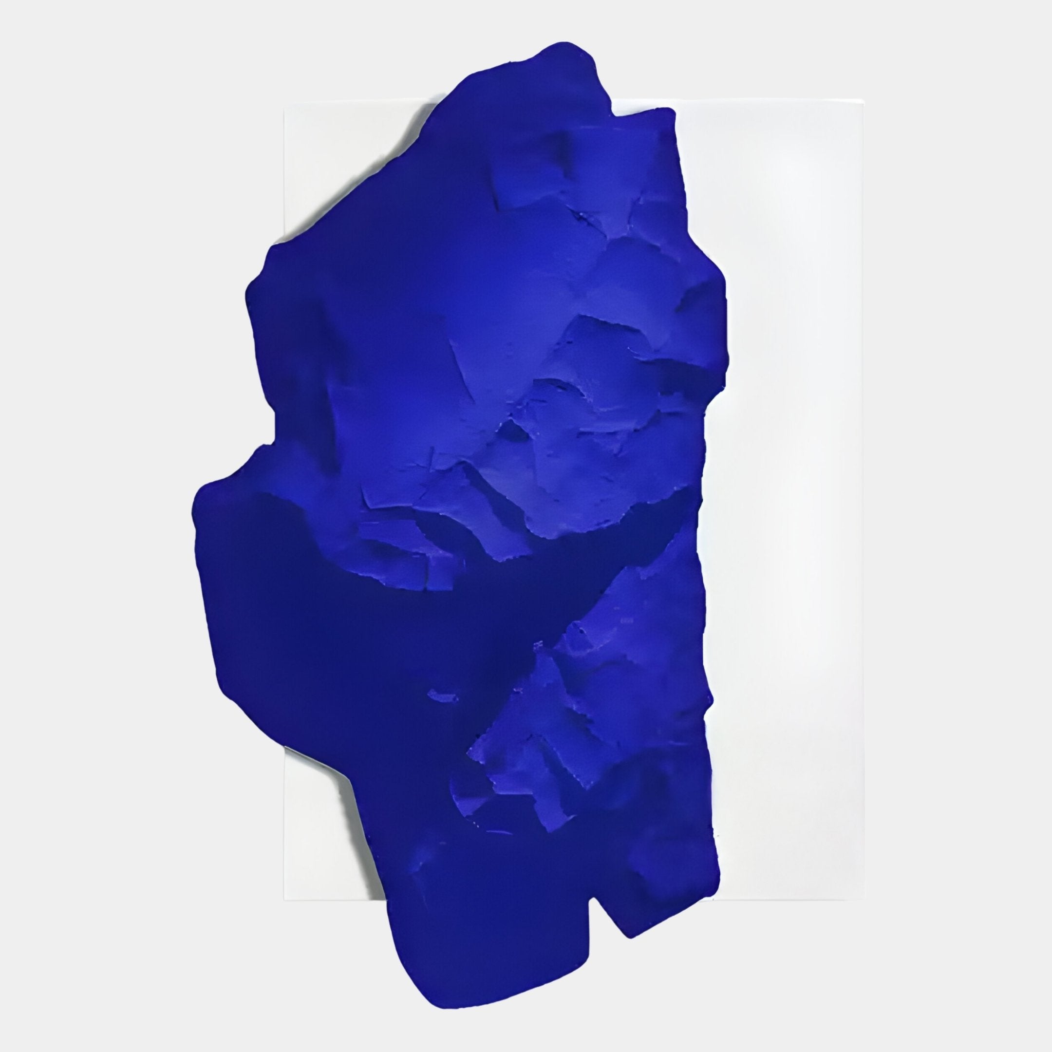 The Veritas White & Sapphire Blue Wood Relief 3D Wall Art by Giant Sculptures features a textured, irregular sapphire blue form on a white rectangle, creating striking minimalist wall art with bold depth.
