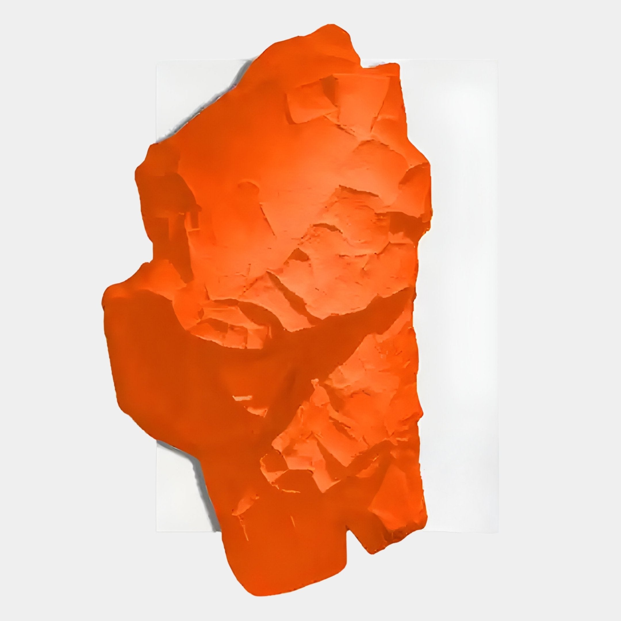 The Veritas White & Orange Wood Relief 3D Wall Art by Giant Sculptures features an irregular, textured orange design displayed against a plain white background.