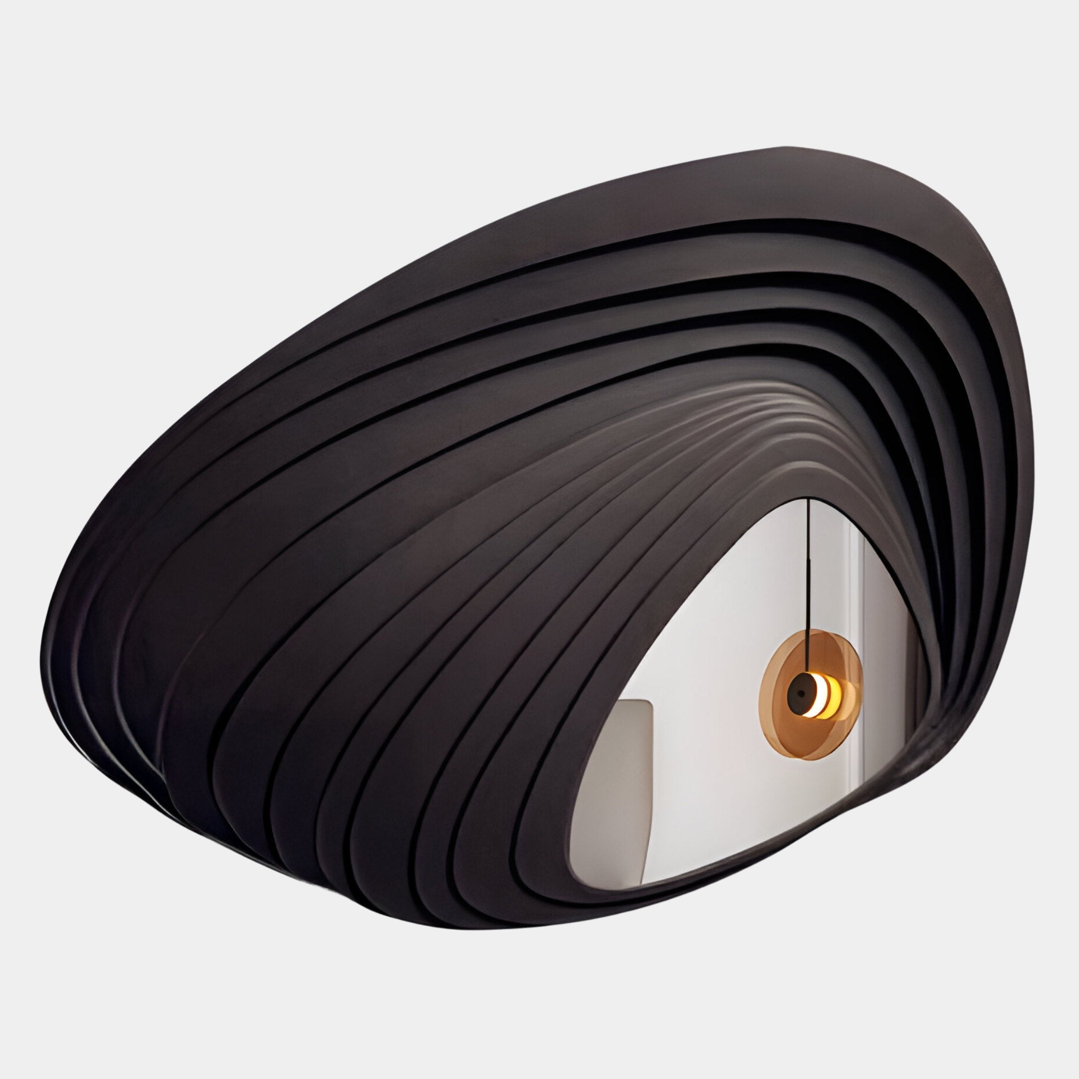 The Reflecta Black Wood Carving Mirror 3D Wall Art by Giant Sculptures features a sculptural, layered oval frame—perfect as striking 3D wall art in a minimalist white room with a round glowing light fixture.