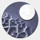 The Verve Soft Purple Wood Relief 3D Wall Art by Giant Sculptures features raised abstract shapes and a large white circle set against a dark, bluish-gray background, creating a striking textured centerpiece for any wall.
