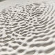 The Reveria Sage Green Abstract Wood Carving 3D Wall Art by Giant Sculptures features an organic, wavy texture that evokes sand dunes, bringing depth and movement to modern interiors.