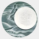 The Reveria Moss Green Abstract Wood Carving 3D Wall Art by Giant Sculptures features a round wavy moss green background with a central white circular plate, showcasing a ripple-textured pattern for modern wall décor.