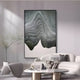 Minimalist living room with modern gray and white furniture, a round coffee table, curved chair, and Giant Sculptures’ Celoria Jade Mist Wood Carving 3D Wall Art in green and gray. A tall plant in a glass vase completes the Wabi-Sabi Interiors vibe.