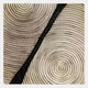 Close-up of the Artura Ivory Square Hand-Painted 3D Relief Wall Art by Giant Sculptures, featuring concentric circular patterns split by a wavy black line—ideal minimalist or abstract décor for indoor spaces.
