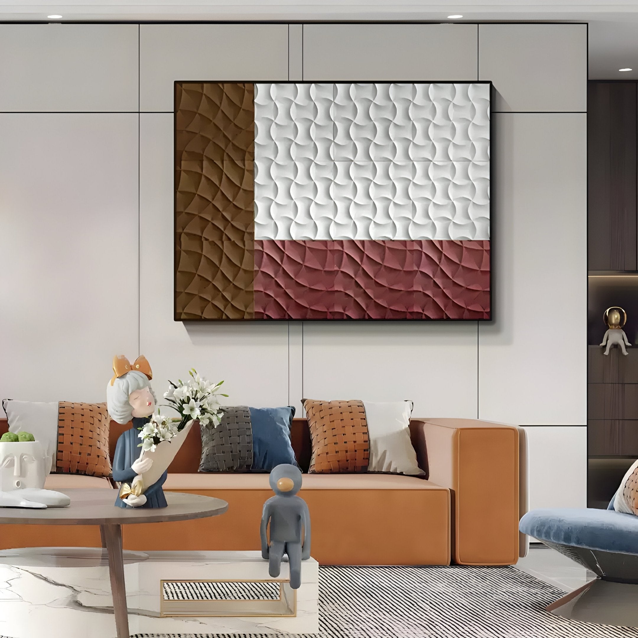 A modern living room with an orange sofa, decorative pillows, and table figurines features the Trelume White, Brown & Rose Wavy Wood Relief 3D Wall Art by Giant Sculptures above the sofa, adding a contemporary and playful geometric accent.