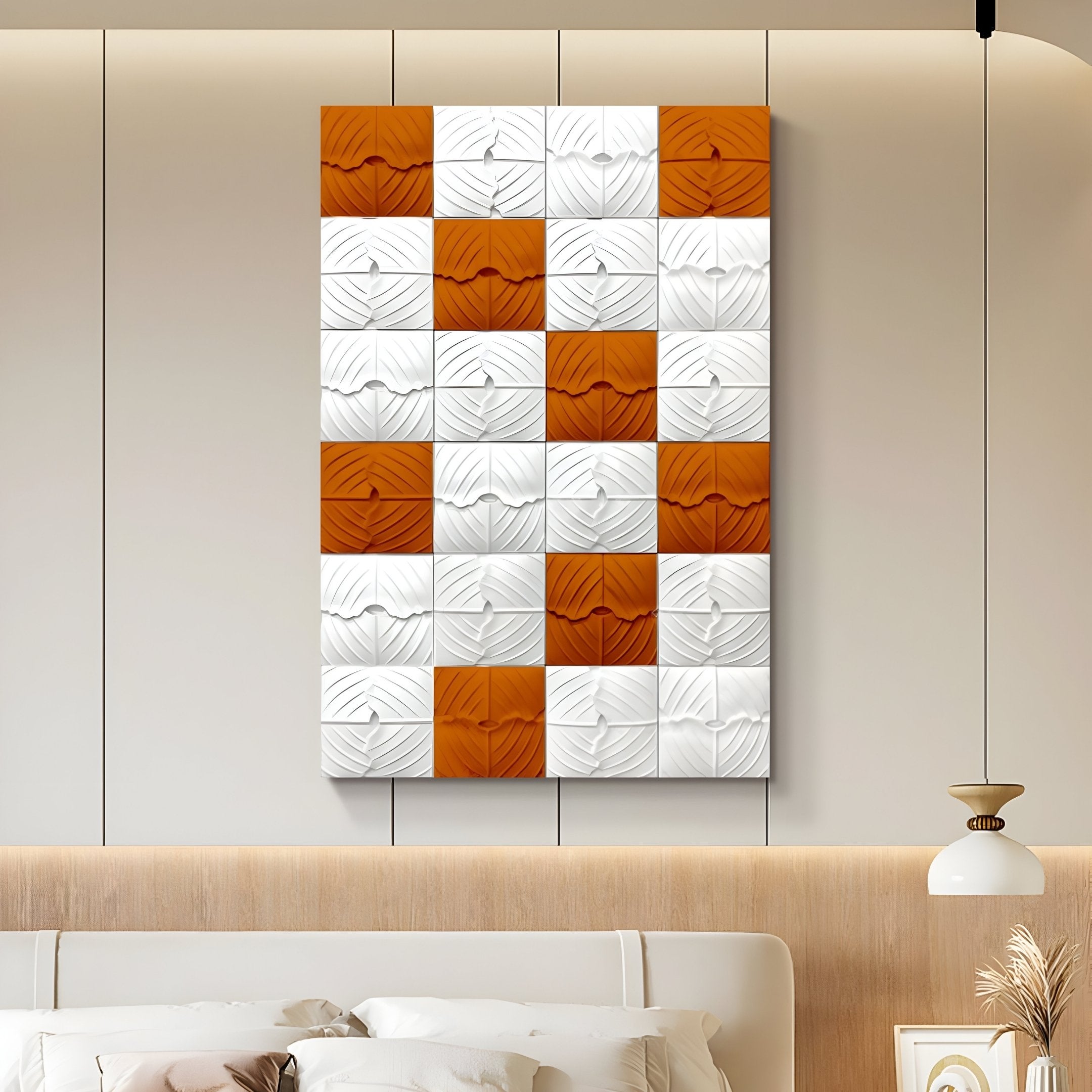 The Vellura White & Orange Textured Wood Relief 3D Wall Art by Giant Sculptures hangs above a modern bed with neutral bedding and a built-in headboard, beside a white and gold wall lamp.