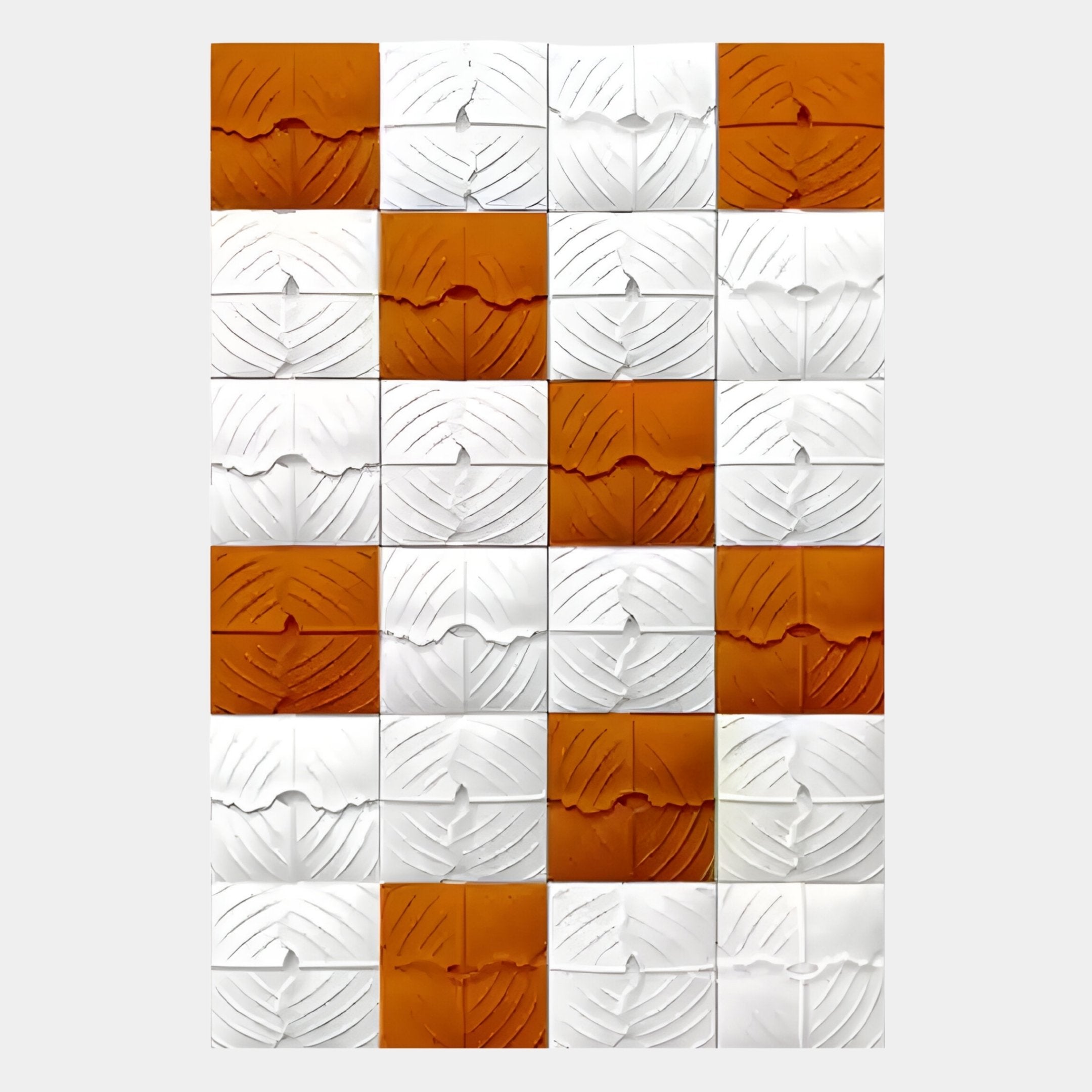 The Vellura White & Orange Textured Wood Relief 3D Wall Art by Giant Sculptures features a grid of square tiles with a leaf-like pattern and alternating colors, creating an eye-catching checkerboard wall panel design.