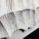 Close-up of Novara White I Hand-Painted Wood Relief 3D Wall Art by Giant Sculptures, featuring white, folded wood with zigzag and dotted gray details that create a textured, layered look against a soft background.