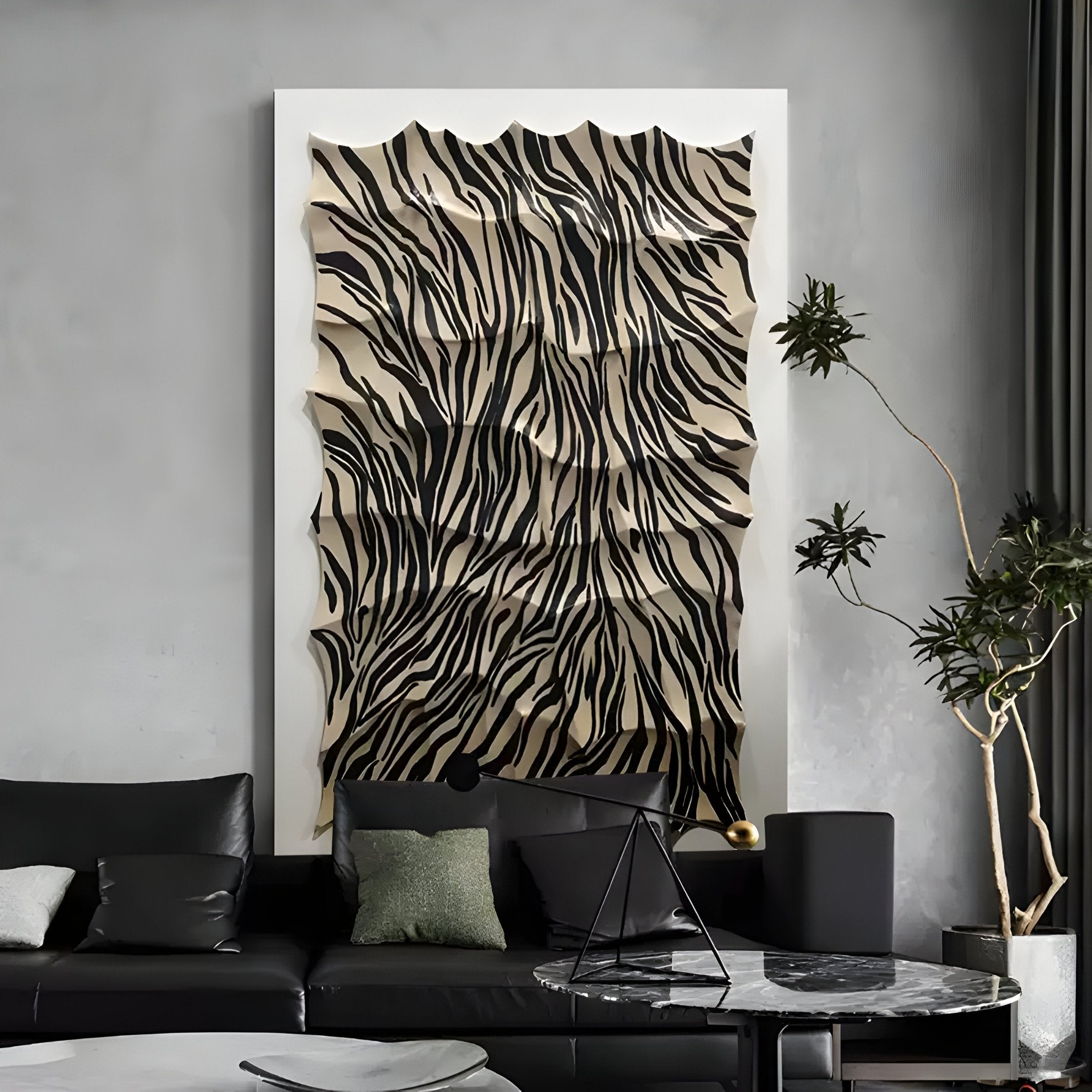A modern living room features a black sofa with decorative pillows, a marble coffee table, and the Novara Zebra II Hand-Painted Wood Relief 3D Wall Art by Giant Sculptures above the sofa. A tall plant on the right complements this striking focal piece.