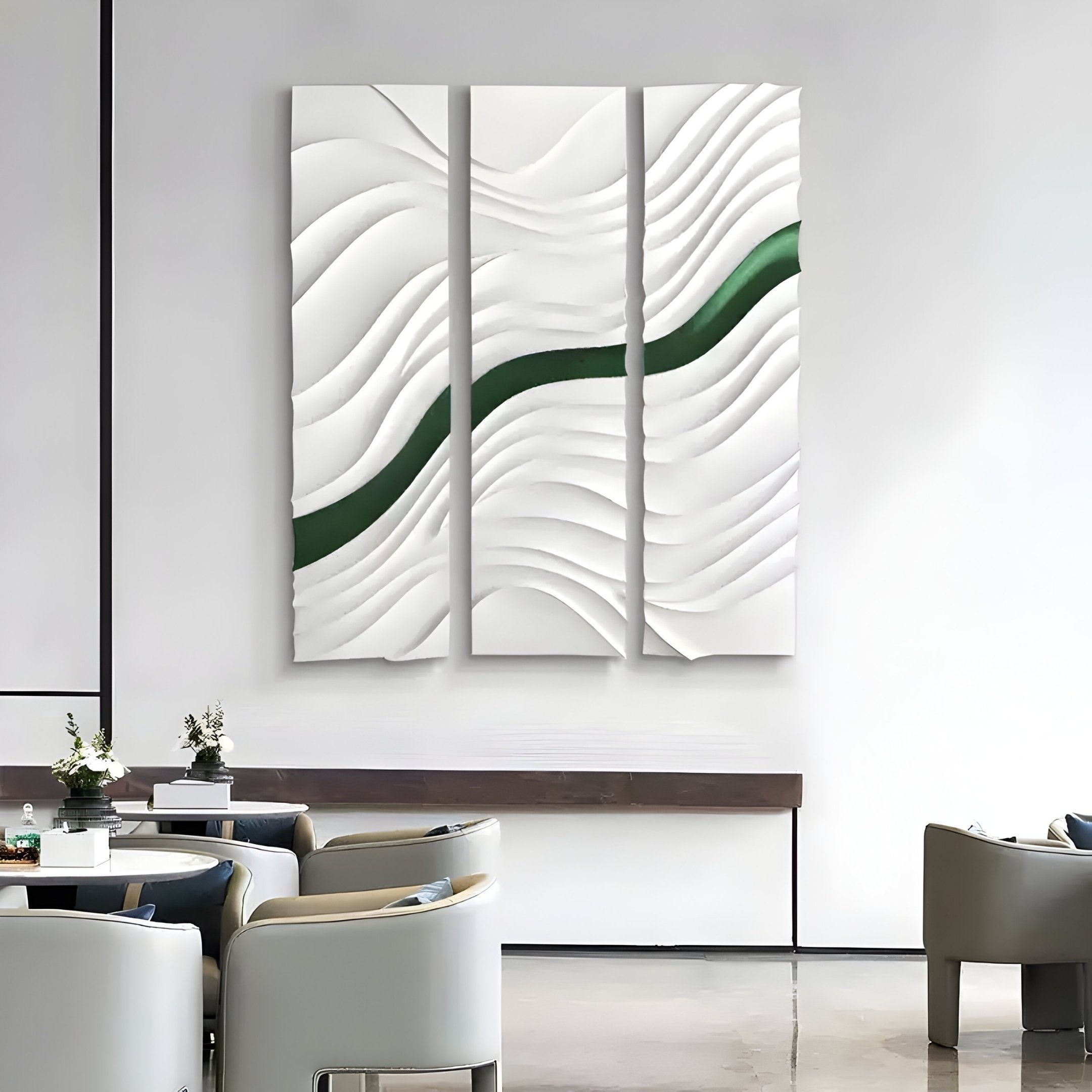 The Evolva 3-Panel White & Green Wood Relief 3D Wall Art by Giant Sculptures features bold green curves on white wavy textures, shown above modern neutral chairs and small tables.