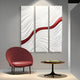 A modern room features a red chair, a round table with books, and the Evolva 3-Panel White & Red Wood Relief 3D Wall Art by Giant Sculptures—three panels with wavy white patterns and a bold red diagonal stripe.