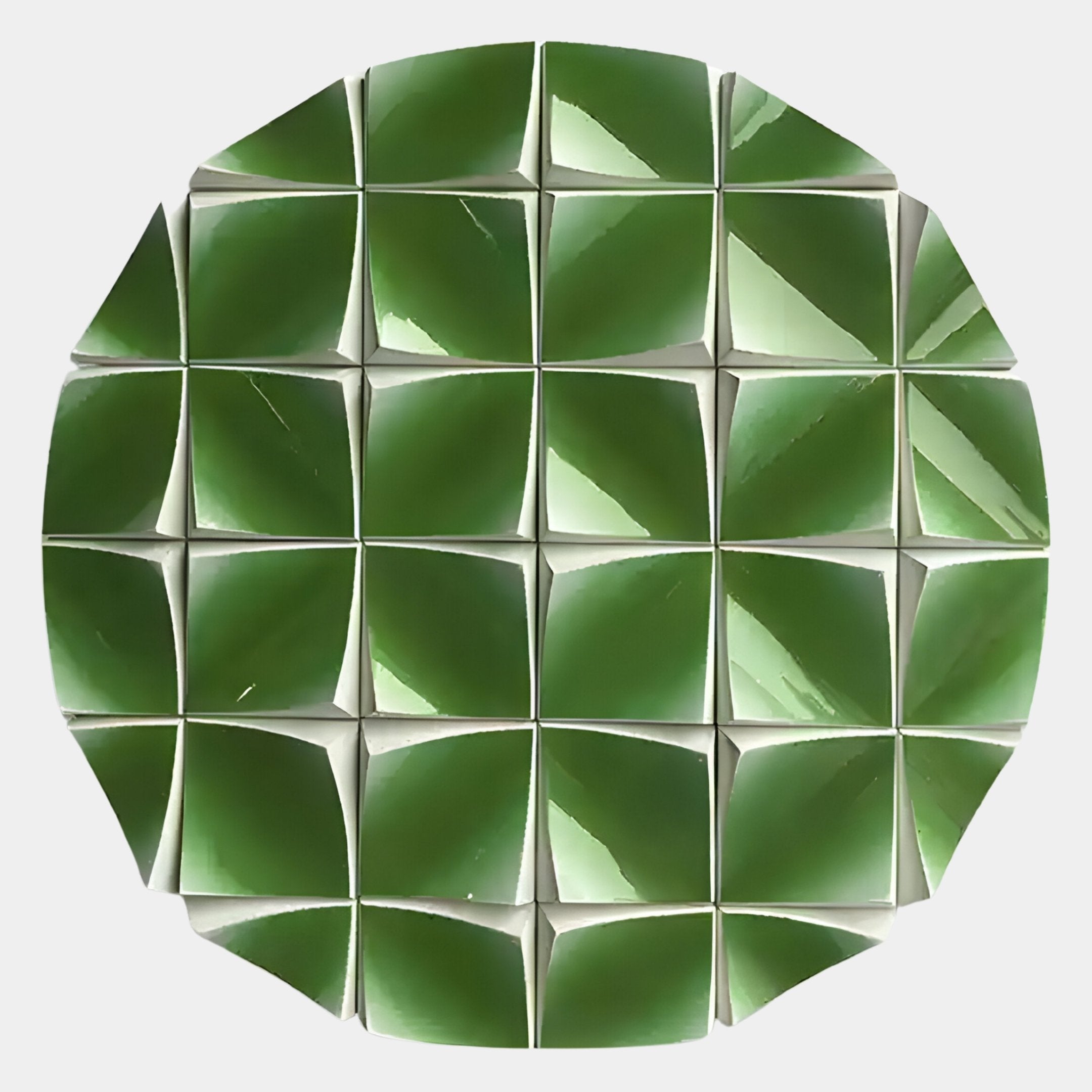 The Incalia Green Circular Geometric Wood Relief 3D Wall Art by Giant Sculptures features shiny, green, pyramid-shaped tiles with square bases arranged in a circle, creating a striking emerald geometric pattern on a white background.