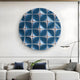 A modern living room featuring a white sectional sofa, blue and gray accent pillows, a minimalist floor lamp, and the Incalia Blue Circular Geometric Wood Relief 3D Wall Art by Giant Sculptures for bold contemporary style.
