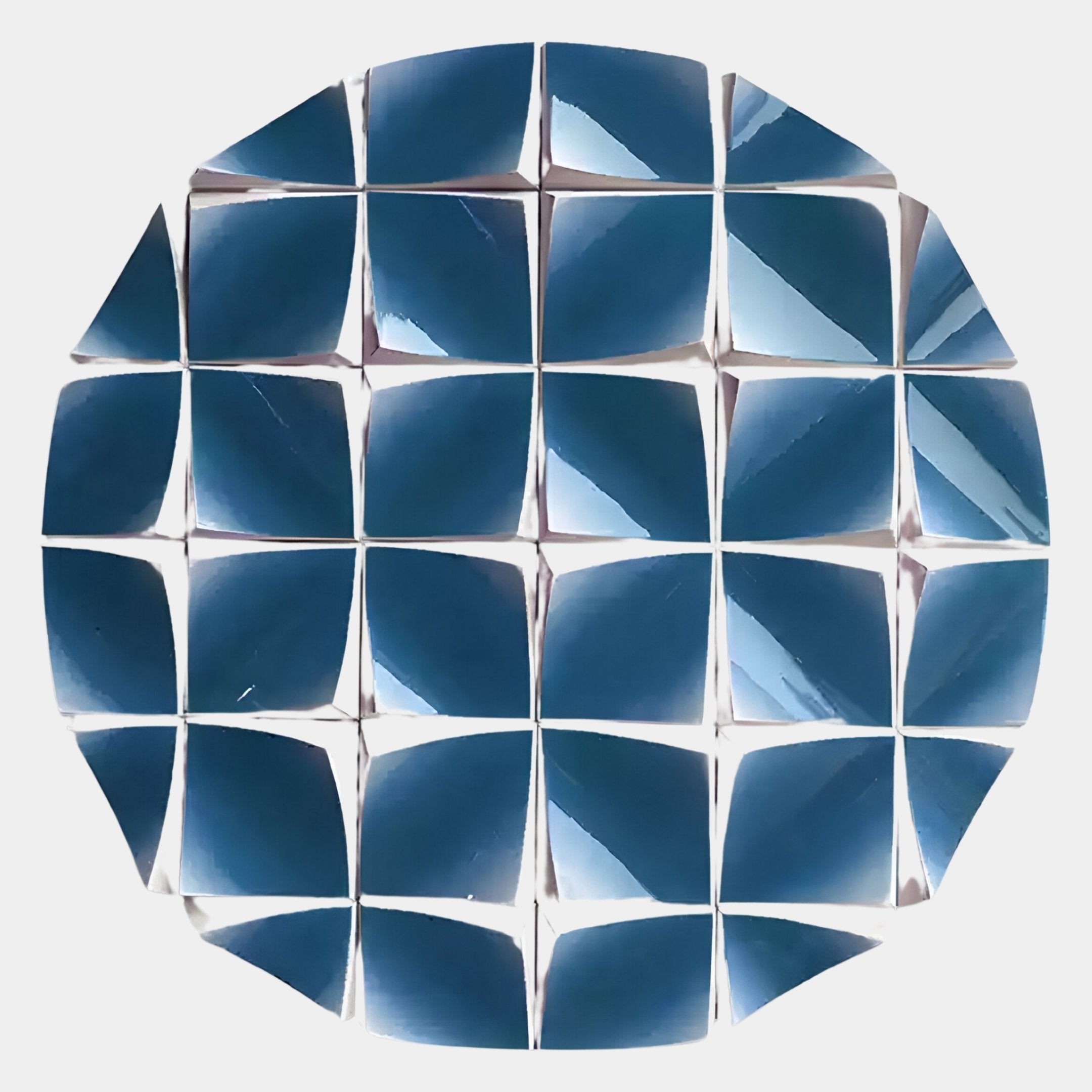 The Incalia Blue Circular Geometric Wood Relief 3D Wall Art by Giant Sculptures features reflective blue, square, slightly curved tiles—creating striking mosaic-like dimension and dramatic light-play for modern interiors.