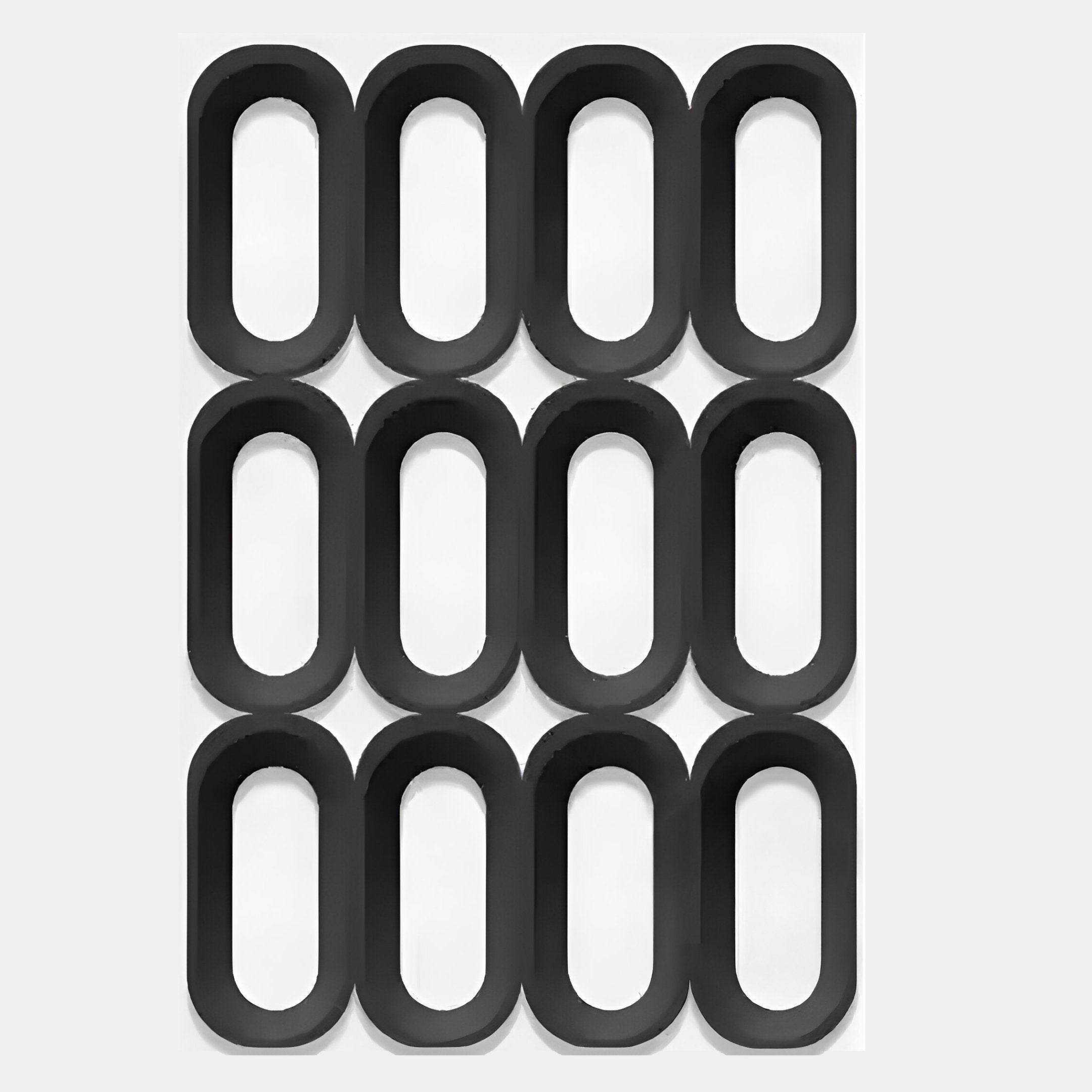 Twelve black ovals are arranged in a 3x4 grid on light gray, each evenly spaced for symmetry. The Revela White & Black Geometric Wood Relief 3D Wall Art by Giant Sculptures offers a modern geometric design.