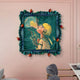 The Fabula Toxic Bubble Pop Anime Wood Relief 3D Wall Art by Giant Sculptures features a sculpted figure in a yellow helmet sprayed with liquid, surrounded by swirls and red pomegranates in a bold wavy blue frame against a pale pink wall.