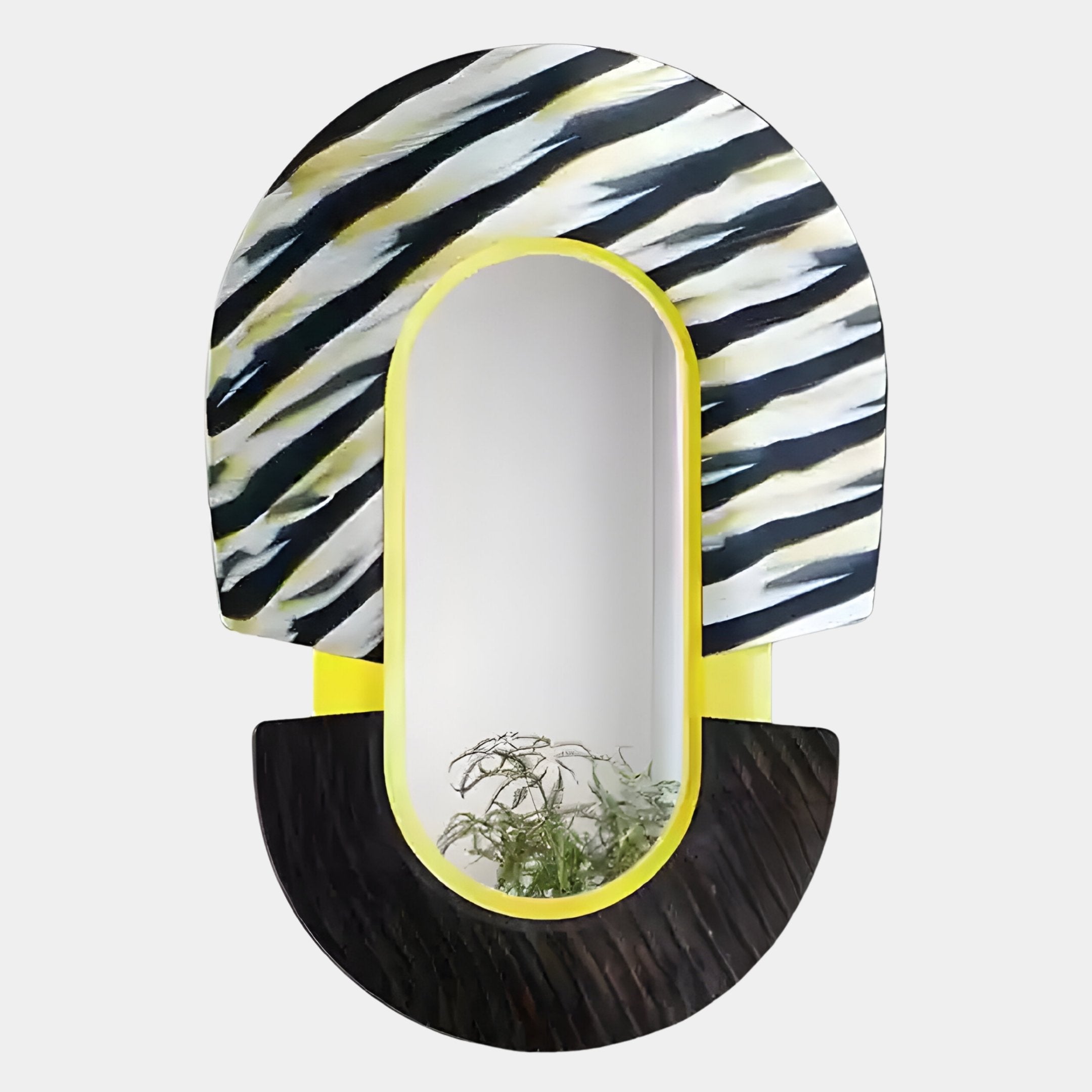 The Arcus Black & Yellow Zebra Stripes Mirror 3D Wooden Wall Art by Giant Sculptures features an oval shape, yellow frame, bold zebra stripes on top, and a textured black semicircle—perfect for reflecting green plants.