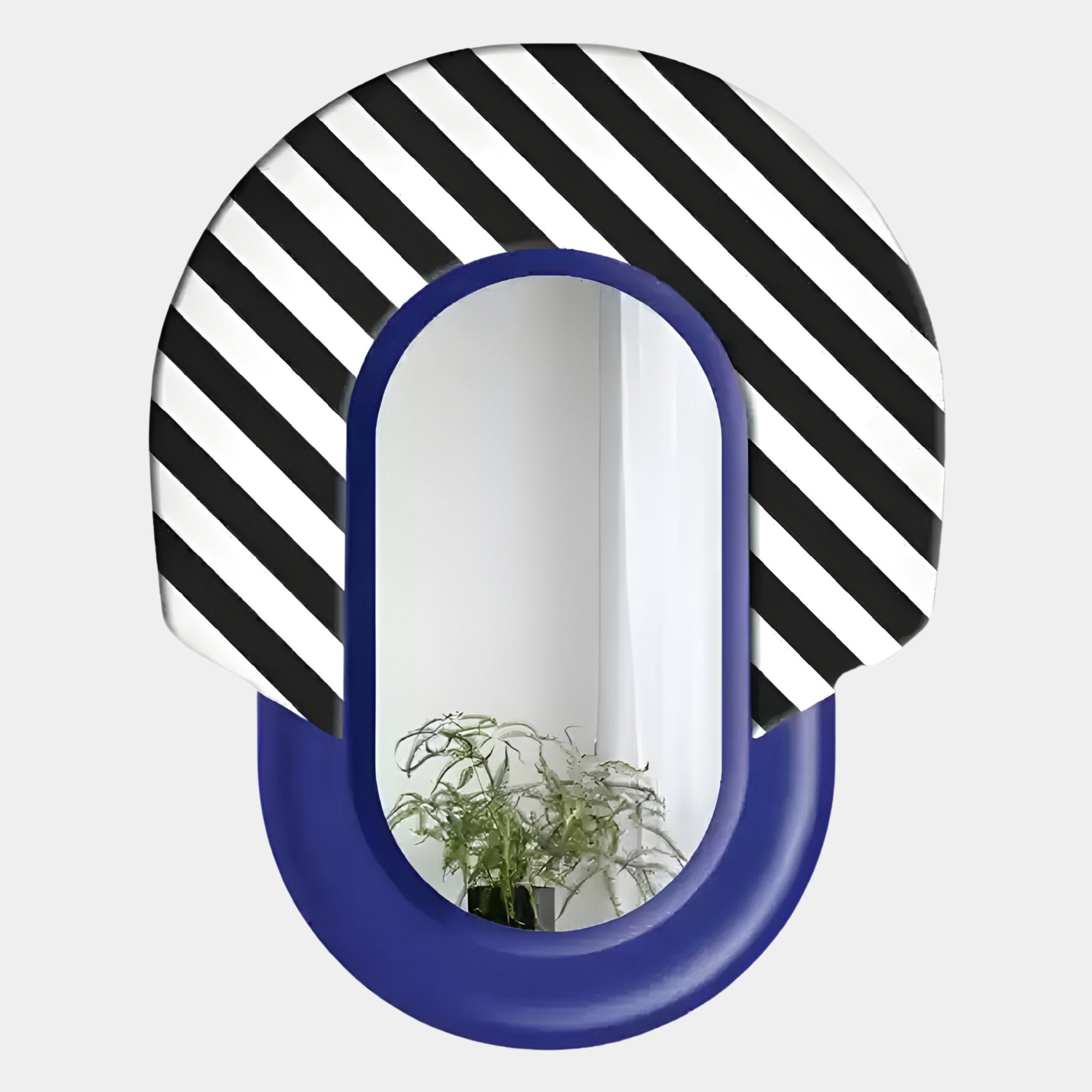 The Arcus Purple & Black-White Striped Mirror 3D Wooden Wall Art by Giant Sculptures features a graphic frame with bold stripes above smooth solid blue, reflecting a plant and white walls in the background.
