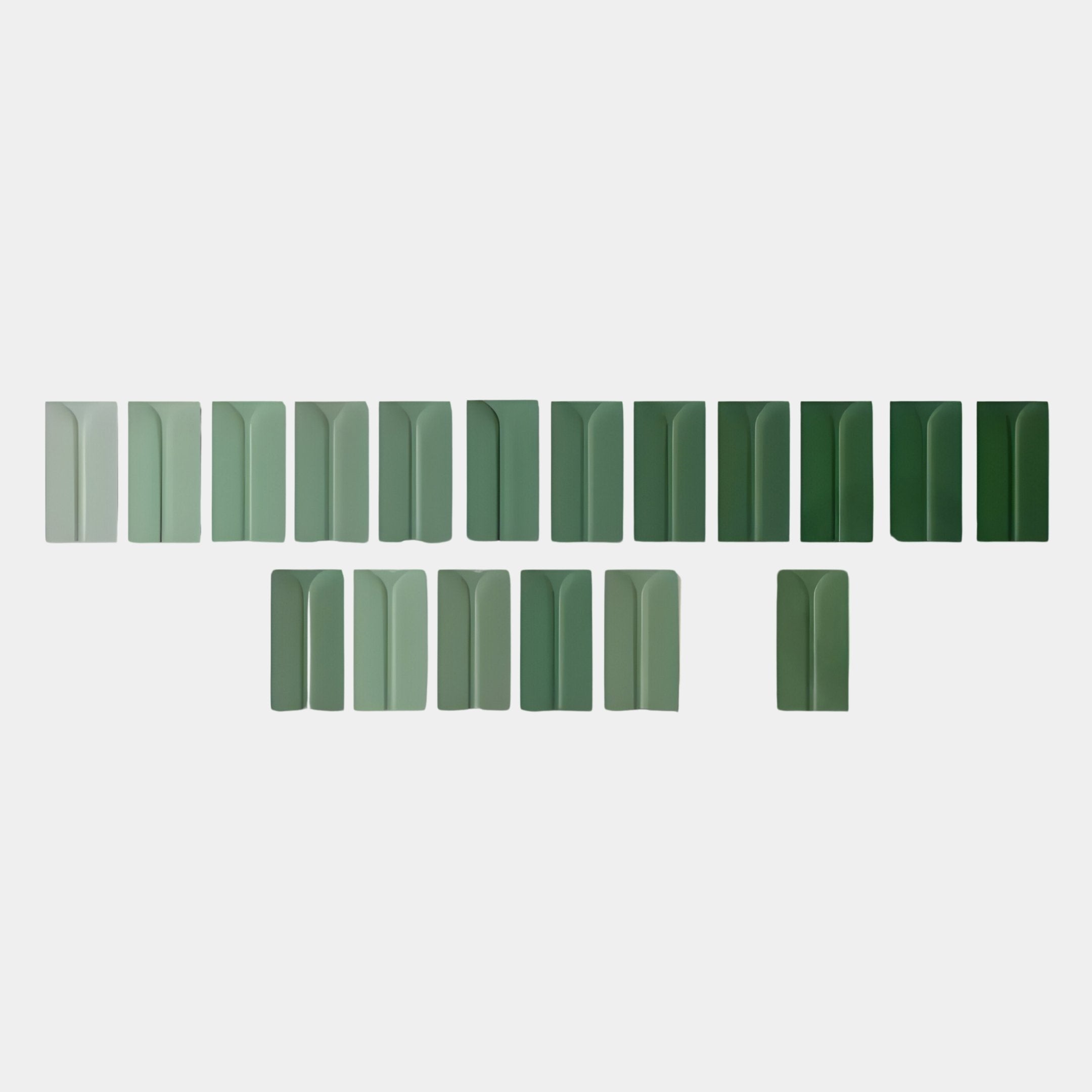 Eximia Green Tones Multi-Panel Wood Relief 3D Wall Art by Giant Sculptures features rectangular tiles in green shades with subtle vertical lines and curves, arranged in two rows—a perfect accent for minimalist Nordic interiors.