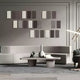 A modern living room with gray tones includes a sleek low-profile sectional sofa, a minimalist coffee table, and the Eximia Brown & Grey Tones Multi-Panel Wood Relief 3D Wall Art by Giant Sculptures. A sculptural lamp and decorative items complete the elegant contemporary space.