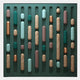 The Formexa Capsule Geometric Wood Relief 3D Wall Art by Giant Sculptures features vertical rows of rounded capsule shapes in teal, copper, beige, and brown on a dark green background—an eye-catching abstract piece ideal for Nordic interiors.