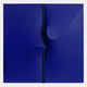 The Delinea Sapphire Blue Stretch Fabric 3D Wood Relief Wall Art by Giant Sculptures features two large dark blue panels with a vertical gap and subtle curved folds, set against a light gray background for a minimalist look.