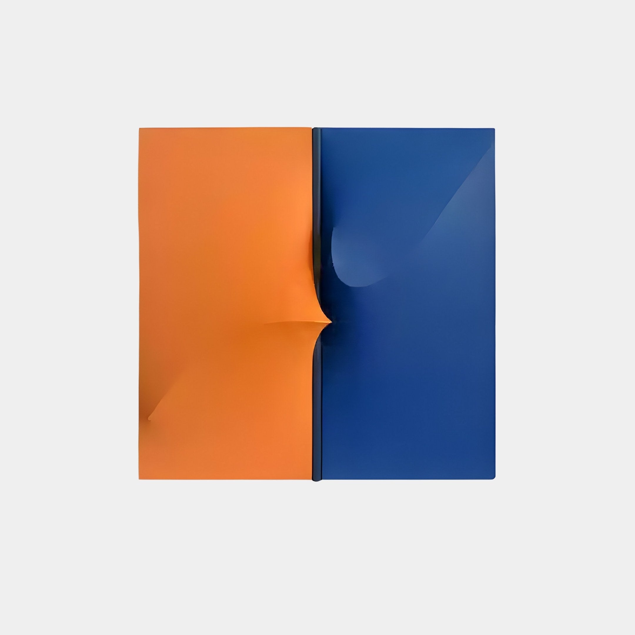 The Delinea Dual Contrast Orange & Blue Fabric 3D Wood Relief Wall Art by Giant Sculptures features two adjacent panels: the left is orange, the right blue. A prominent vertical crease slightly curved outward adorns both panels against a light gray background.