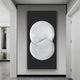 The Artivio Black & White Wood Relief 3D Wall Art by Giant Sculptures showcases a modern geometric three-dimensional white abstract design on a dark background. Its mounted in a minimalist, brightly lit room with white walls and floors.