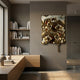 A modern, minimalist study with built-in wooden shelves and desk, neutral walls, and the Giant Sculptures Lumineris Gold Drip Cascade Metal 3D Wall Art adding a striking melting effect to the gray accent wall by the large window.