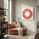 A cozy reading nook with a rust chaise lounge, neutral throw, and minimalist decor. The Plumesse Coral Bloom Layered Feather 3D Wall Art by Giant Sculptures hangs on a light wall near a sunlit window.