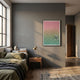 A cozy bedroom features a bed with green and beige bedding, a wooden nightstand with a gold lamp, and Giant Sculptures' Lumevara Rose Green Fade Gradient & Chrome Droplet 3D Wall Art on a gray wall, all bathed in warm sunlight.
