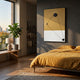 A modern bedroom with a large window, a bed in mustard yellow bedding, and a potted plant features Giant Sculptures’ Linexis Ochre Geometric Linework 3D Wall Art, with sunlight illuminating minimalist decor and wooden floors.