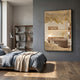 A cozy bedroom with a gray accent wall, large bed with blue and beige bedding, wood floors, a modern bookshelf, floor lamp, and the Auritone Gold Textured Steel Mirrored 3D Wall Art by Giant Sculptures as a bold statement above the bed.