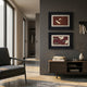 Kansora Heritage Crane Flight 2-Set Framed Wall Art by Giant Sculptures, white cranes on oxblood red in black frames, displayed above a walnut console.