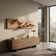 Orbivance Amber, Gold & White Sphere Panel 3D Wall Art by Giant Sculptures, mounted above a walnut sideboard with a brass lamp in a sunlit modern living room.