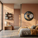 Aurelios Amber Flare Crystal Porcelain & Gold Orbit 3D Wall Art by Giant Sculptures mounted on a peach bedroom wall above a bed with grey and amber linen.