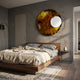 Aurelios Amber Crystal Porcelain & Gold Orbit 3D Wall Art by Giant Sculptures mounted above a walnut platform bed in a modern grey-walled bedroom.